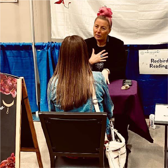 photo of Michlle Mejaski and client during a reading